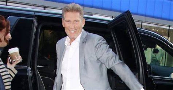 Gerry Turner is seen smiling at the camera while wearing a tuxedo.