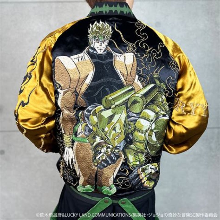 Jojo sin a green jacket with hand on his chin