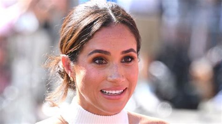 Meghan Markle is looking into the distance.