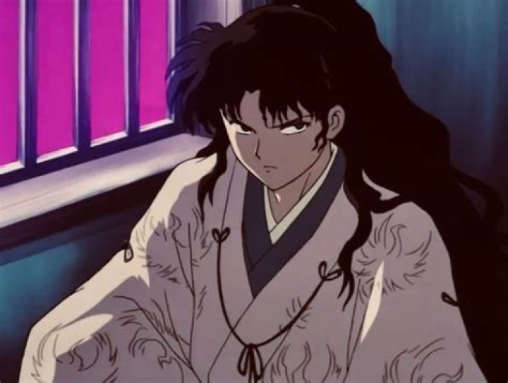 Naraku sitting down in white gi