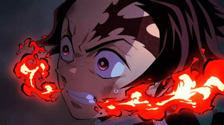 Tanjiro using fire technique and slashing through the air